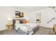 Comfortable bedroom with natural light, decorative pillows, stylish decor, and a full-length mirror for added convenience at 3734 Coleman Dr, Charlotte, NC 28215