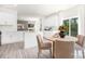 Bright, open kitchen with white cabinets, modern appliances, and a breakfast nook for casual dining at 3734 Coleman Dr, Charlotte, NC 28215