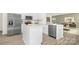 Modern kitchen featuring white cabinetry, stainless steel appliances, and an island with a breakfast bar at 3734 Coleman Dr, Charlotte, NC 28215