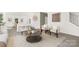 Open-concept living area featuring comfortable seating, stylish decor, and a view of the modern kitchen at 3734 Coleman Dr, Charlotte, NC 28215