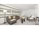 Stylish living room with an accent wall, comfortable seating, modern decor, and ample natural light at 3734 Coleman Dr, Charlotte, NC 28215