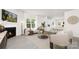 Spacious living room with fireplace, plush seating, large window, and seamless connection to the kitchen at 3734 Coleman Dr, Charlotte, NC 28215