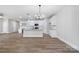 Bright living room view into the spacious modern eat in kitchen with island at 3926 Litchfield Rd, Charlotte, NC 28211