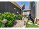 Cozy backyard with stepping stones, lush plants, birdhouses, and decorative accents at 4014 Pleasant Run Dr, Stallings, NC 28227