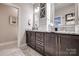 Stylish bathroom with dual vanities, modern fixtures, and attractive finishes at 4014 Pleasant Run Dr, Stallings, NC 28227