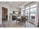 Bright dining area with neutral color scheme, modern chandelier, and large windows at 4014 Pleasant Run Dr, Stallings, NC 28227