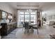 Elegant dining area with natural light, stylish chandelier, and view to other rooms at 4014 Pleasant Run Dr, Stallings, NC 28227