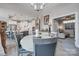 Open dining room with updated kitchen and access to an outdoor living area at 4014 Pleasant Run Dr, Stallings, NC 28227