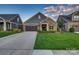 Charming single-Gathering home featuring a stone facade, well-manicured lawn, and an attached two-car garage at 4014 Pleasant Run Dr, Stallings, NC 28227