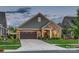 Charming single-Gathering home featuring a brick and siding exterior, an attached garage, and a well-maintained front yard at 4014 Pleasant Run Dr, Stallings, NC 28227