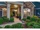 Inviting front porch with stone accents, stylish decor, and a welcoming entrance to the home at 4014 Pleasant Run Dr, Stallings, NC 28227
