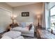 Cozy room with couch, pillows, and lamps for a relaxing ambiance at 4014 Pleasant Run Dr, Stallings, NC 28227