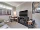 Comfortable living room featuring a large screen TV and inviting decor at 4014 Pleasant Run Dr, Stallings, NC 28227