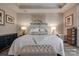 Comfortable main bedroom featuring luxury bedding, soft lighting, and stylish decor at 4014 Pleasant Run Dr, Stallings, NC 28227