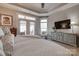 Open bedroom with outside access, soft textures, and a large television for relaxing at 4014 Pleasant Run Dr, Stallings, NC 28227