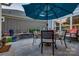 Outdoor patio features a dining area under a large umbrella with a well-decorated retaining wall at 4014 Pleasant Run Dr, Stallings, NC 28227