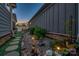 Landscaped side yard with decorative stones, lush greenery, and charming pathway lighting at 4014 Pleasant Run Dr, Stallings, NC 28227