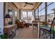 Cozy sunroom with comfortable seating, natural light, and beautiful views of the outdoors at 4014 Pleasant Run Dr, Stallings, NC 28227