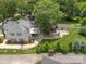 Aerial view showcasing the home's backyard with patio, lush greenery, and outdoor space at 420 S Cedar St, Lincolnton, NC 28092