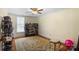 Spacious bedroom featuring hardwood floors, area rug, and shelving for shoe and accessory storage at 420 S Cedar St, Lincolnton, NC 28092
