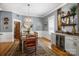 Charming dining room with built-in cabinets, a wine fridge, and natural light from the window at 420 S Cedar St, Lincolnton, NC 28092