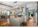 Open kitchen layout with a view of the dining area, featuring a stylish island and modern lighting at 420 S Cedar St, Lincolnton, NC 28092
