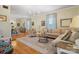 Open-concept living room showcasing hardwood floors, light walls, and lots of natural light at 420 S Cedar St, Lincolnton, NC 28092
