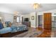 Beautiful main bedroom featuring hardwood floors, neutral paint, and an ensuite bathroom at 420 S Cedar St, Lincolnton, NC 28092