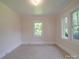 Bedroom with natural light, neutral carpet, and access to the rest of the home at 435 W Whitley St, Norwood, NC 28128