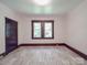 Bright bedroom featuring beautiful gray floors and natural light from a large window at 435 W Whitley St, Norwood, NC 28128