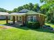 Charming single-story brick home with well-maintained lawn and mature trees at 435 W Whitley St, Norwood, NC 28128
