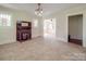 Inviting living room with a fireplace, neutral paint, and ample natural light at 435 W Whitley St, Norwood, NC 28128