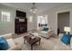 Cozy, furnished living room with a fireplace, offering a comfortable and inviting atmosphere at 435 W Whitley St, Norwood, NC 28128
