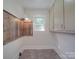 Small pantry with wooden shelves, providing ample storage space at 435 W Whitley St, Norwood, NC 28128