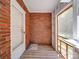 Brick walled porch with screen door and wooden floor at 435 W Whitley St, Norwood, NC 28128