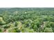 Aerial view of the area showcasing the neighborhood's lush greenery, mature trees, and surrounding residential properties at 4633 Old Mill Rd, Gastonia, NC 28056
