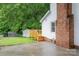 View of the backyard, deck and shed, showcasing the outdoor living and storage options at 4633 Old Mill Rd, Gastonia, NC 28056