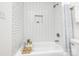 Clean bathroom featuring subway tile, a bathtub and stylish decor at 4633 Old Mill Rd, Gastonia, NC 28056