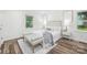 Relaxing bedroom featuring natural light and a neutral color palette at 4633 Old Mill Rd, Gastonia, NC 28056