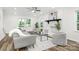Bright living room featuring a decorative fireplace and cozy gray seating at 4633 Old Mill Rd, Gastonia, NC 28056