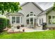 Charming backyard patio with seating, grill, and view of the home's architecture at 539 Turquoise Way, Fort Mill, SC 29708