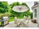Inviting backyard patio with outdoor seating, grill, and lush green landscaping at 539 Turquoise Way, Fort Mill, SC 29708