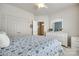 Bright bedroom featuring blue and white bedding and dresser with mirror at 539 Turquoise Way, Fort Mill, SC 29708