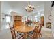 Elegant dining area with a chandelier and a large table, perfect for gatherings at 539 Turquoise Way, Fort Mill, SC 29708