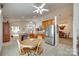 Open kitchen design with wood cabinets and an adjacent dining area at 539 Turquoise Way, Fort Mill, SC 29708