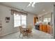 Cozy kitchen with light wood cabinets and a breakfast table by the window at 539 Turquoise Way, Fort Mill, SC 29708