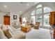Bright and airy living room featuring large windows and a cozy fireplace at 539 Turquoise Way, Fort Mill, SC 29708