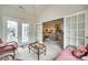 Bright sun room with furniture and doors leading inside and outside at 539 Turquoise Way, Fort Mill, SC 29708