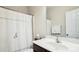 Well lit half bathroom with white tile floors and modern fixtures at 5424 Morris Hunt Dr, Fort Mill, SC 29708