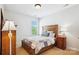 Bright bedroom with wooden furniture, including a bed and a nightstand at 5424 Morris Hunt Dr, Fort Mill, SC 29708